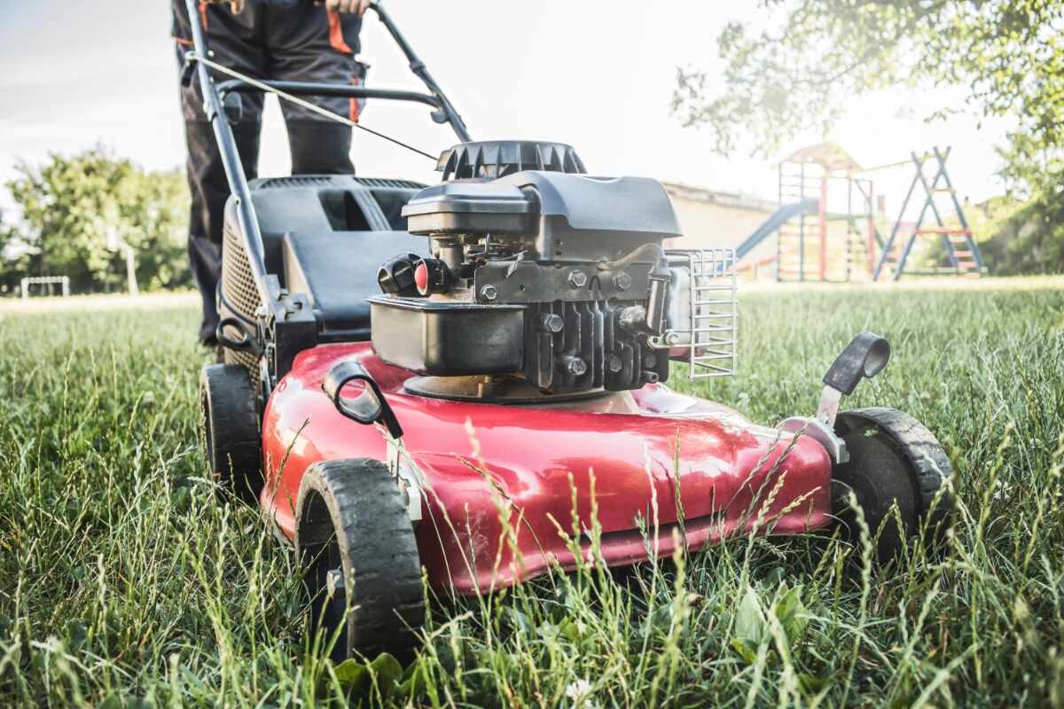 Walk-behind mower cutting a residential lawn